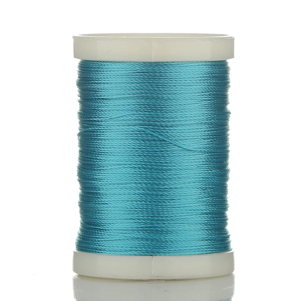 A spool of 150M multi-braided polyester fishing line in teal color.