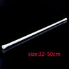 A white adjustable metal curtain rod, 32-50cm long, shown against a black background.