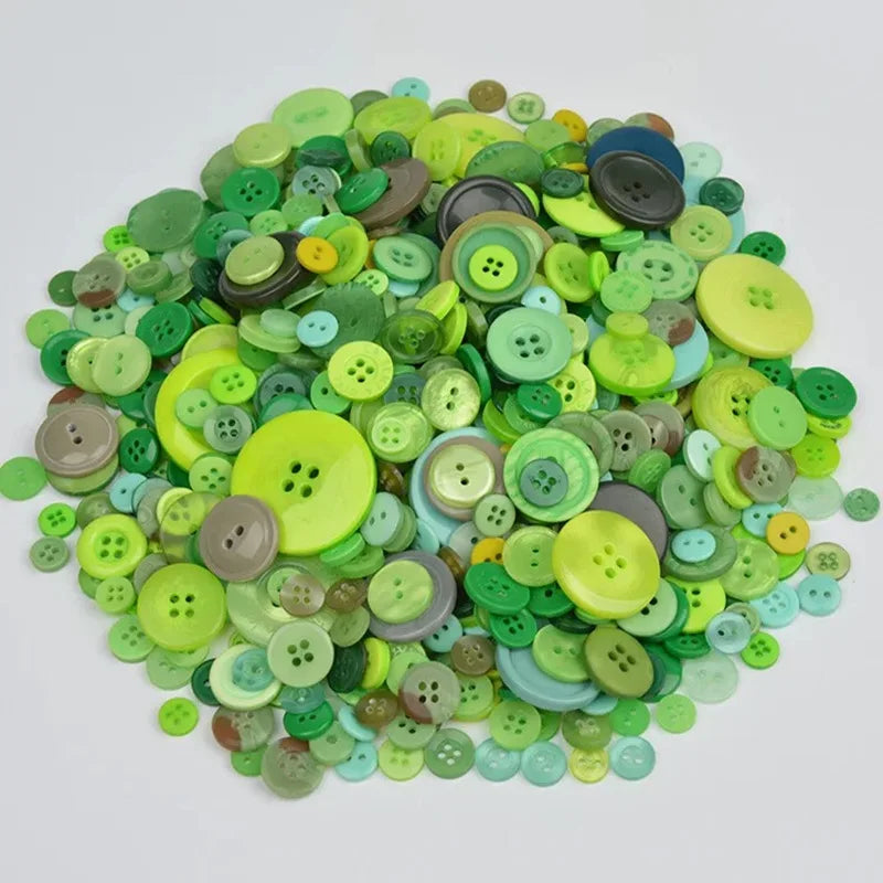 A pile of mixed size wooden buttons in various shades of green, yellow, and blue.