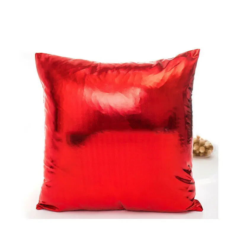A square red pillow covered in metallic shine fabric.