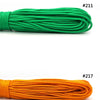 A collection of multi-colored paracord ropes in various colors including red, green, orange, yellow, and blue.
