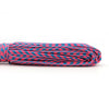 A coil of durable multi-color paracord rope featuring shades of red, blue, and black.