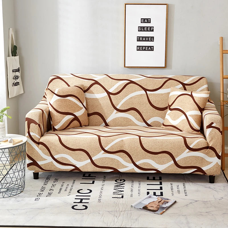 A beige stretch floral elastic sofa cover displayed on a light gray floor.