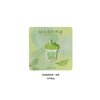 A green embroidered patch shaped like a cup of iced matcha tea with a straw.