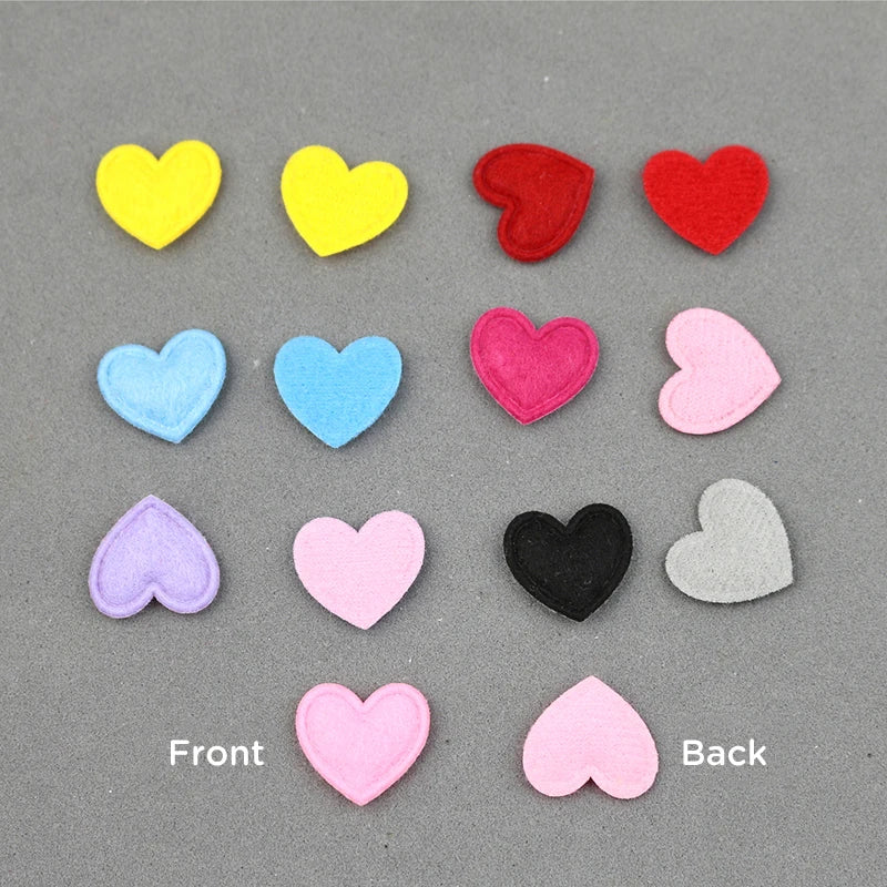 A collection of colorful felt heart appliques in various shades including yellow, red, blue, pink, and gray.