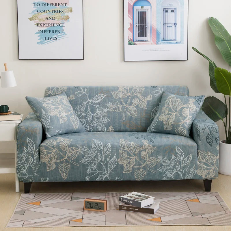 A light blue stretch floral elastic sofa cover displayed on a sofa in a living room setting.