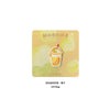 An embroidered patch featuring a yellow iced tea drink design on a light yellow background.