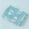 Light blue muslin swaddle blanket with white animal designs