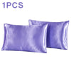 One silky purple satin pillowcase shown next to another one.