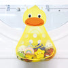 A yellow duck bath toy with an orange beak and yellow polka dots, filled with small bath toys.