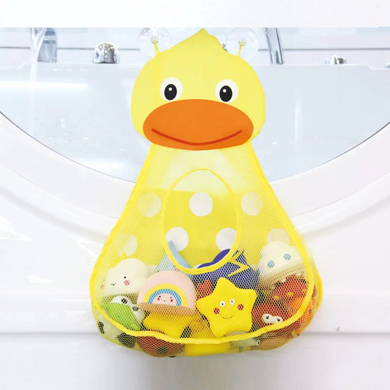 A yellow duck bath toy with an orange beak and yellow polka dots, filled with small bath toys.