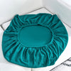 Teal stretch sofa seat cushion protector slipcover with a textured, ruffled design