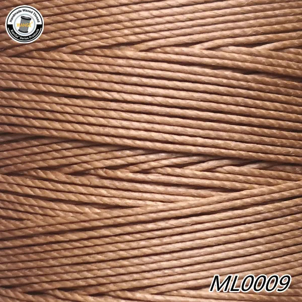 A close-up view of brown waxed thread embroidery cord with a white label and the product code ML0009.