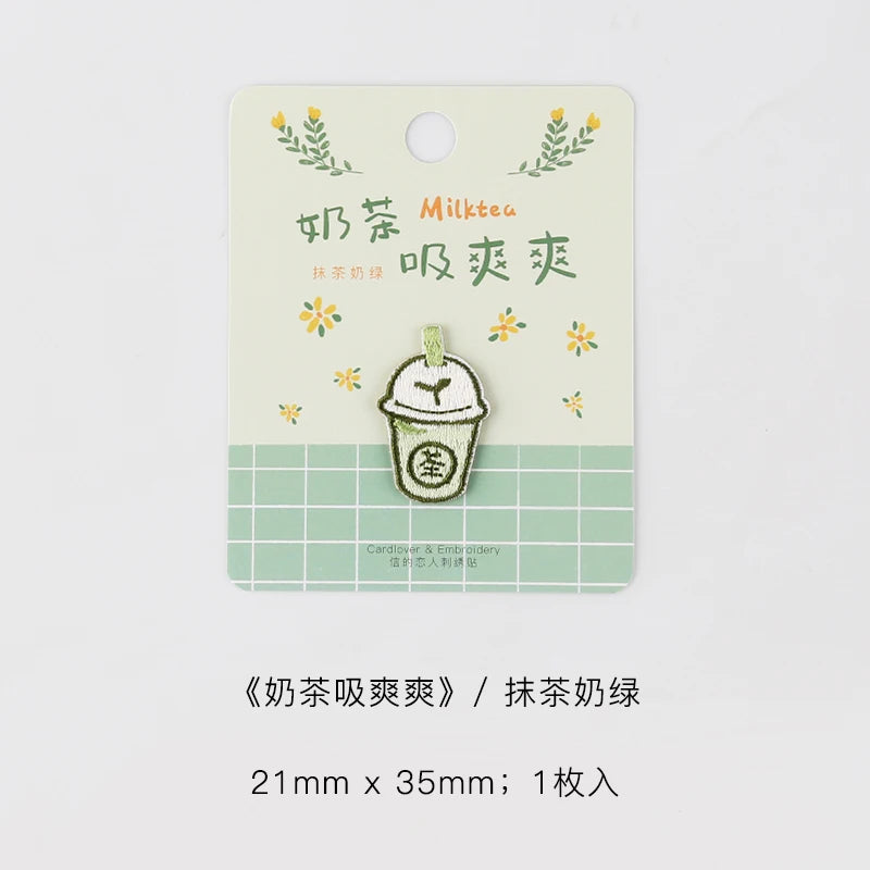 A set of embroidered patches featuring a milk tea theme, including a cup design and text.