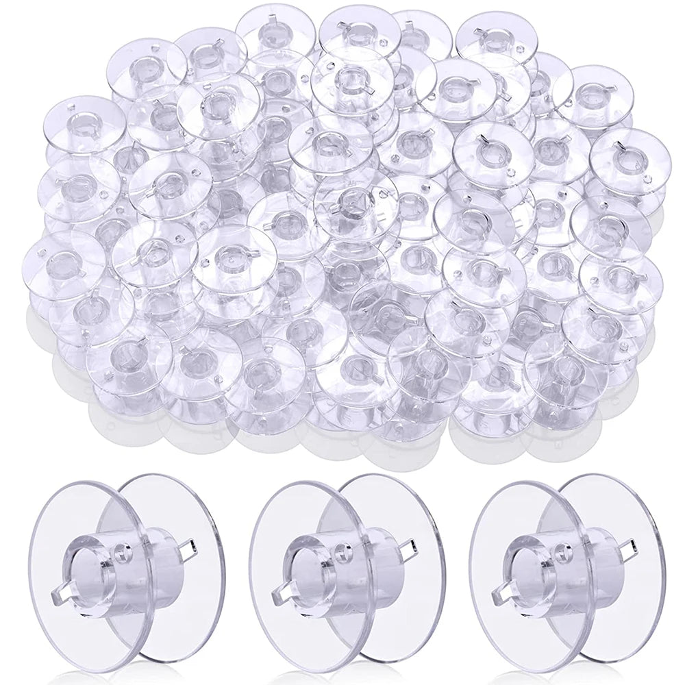 A large quantity of transparent plastic sewing machine bobbins or spools arranged in a pile.