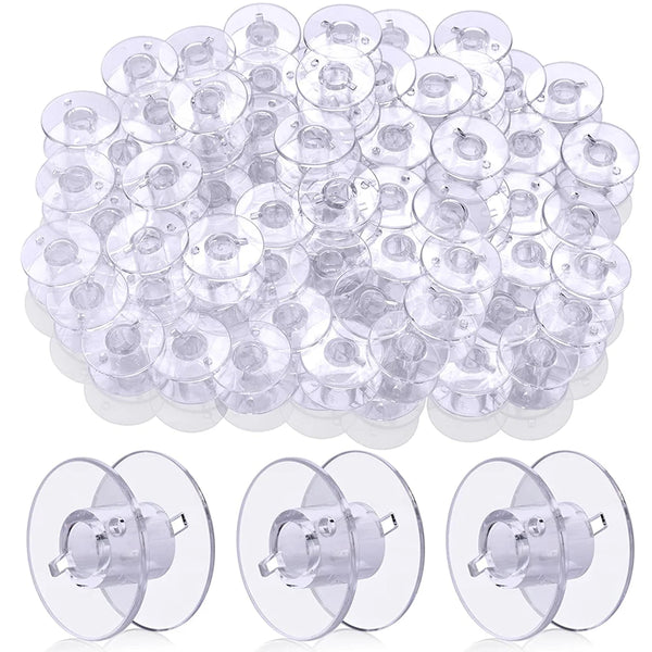 A large quantity of transparent plastic sewing machine bobbins or spools arranged in a pile.