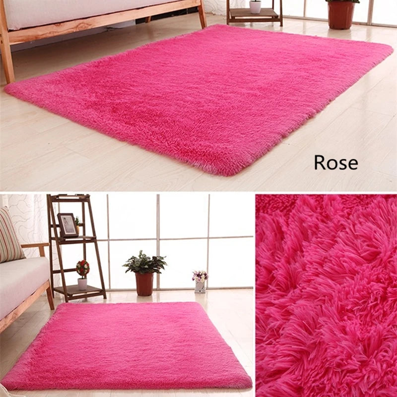 A vibrant pink plush throw rug displayed on a light wooden floor.