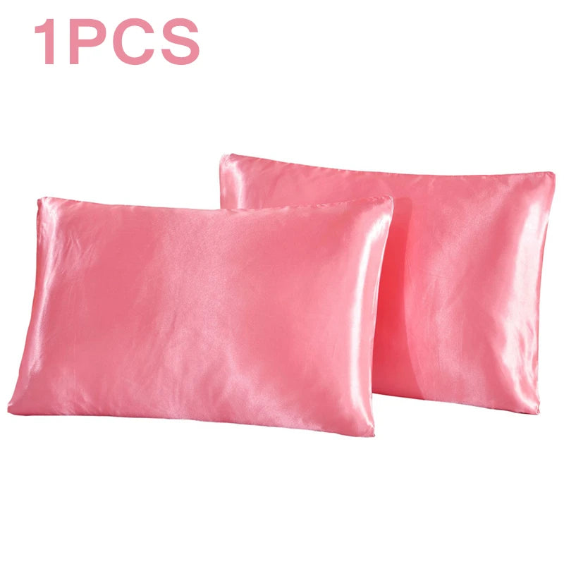 One pink silky satin pillowcase shown in a rectangular shape.