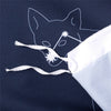 A dark blue fabric features a white outline of a fox head with stars, tied by a white string.