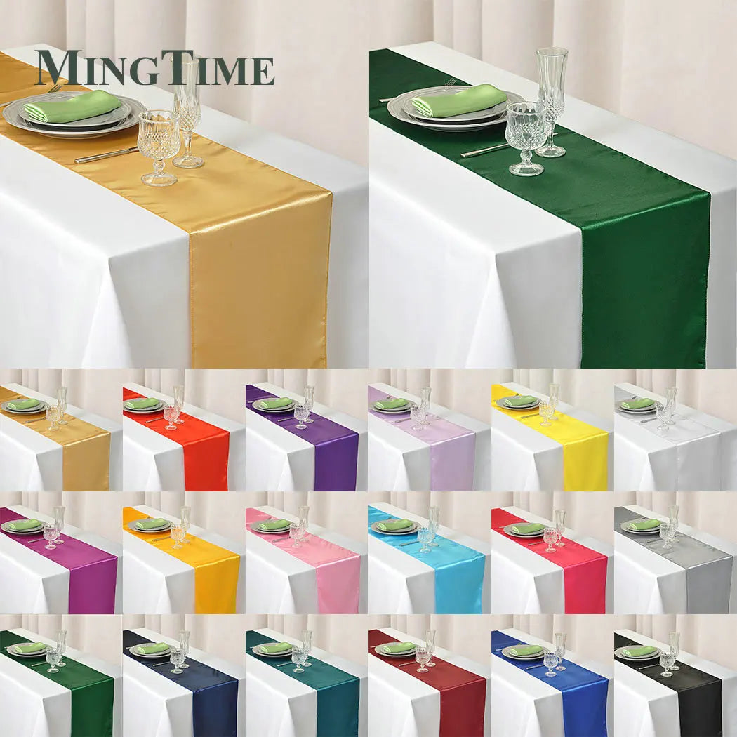 Various colored satin table runners displayed on white tables for events and home decor