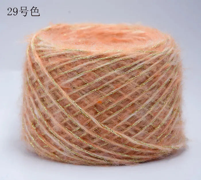 A ball of metallic orange merino wool yarn used for hand knitting.