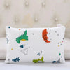 A white cartoon style children's pillowcase featuring various colorful animal and geometric shapes.