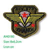 Embroidered iron-on patch featuring a dark olive green background with yellow wings and red stars, labeled OIV X79 and ZHANDI