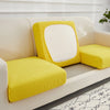 A yellow textured fleece seat cushion cover is placed on a light-colored sofa.
