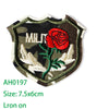 Embroidered iron-on patch featuring a red rose and white wings on a dark olive green background.