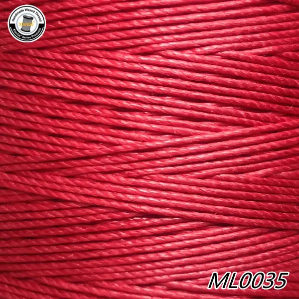 Close-up of red wax thread embroidery cord with a manufacturer's logo visible on the left.