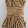 A bundle of 12mm 50m natural hemp jute rope in a light tan color.