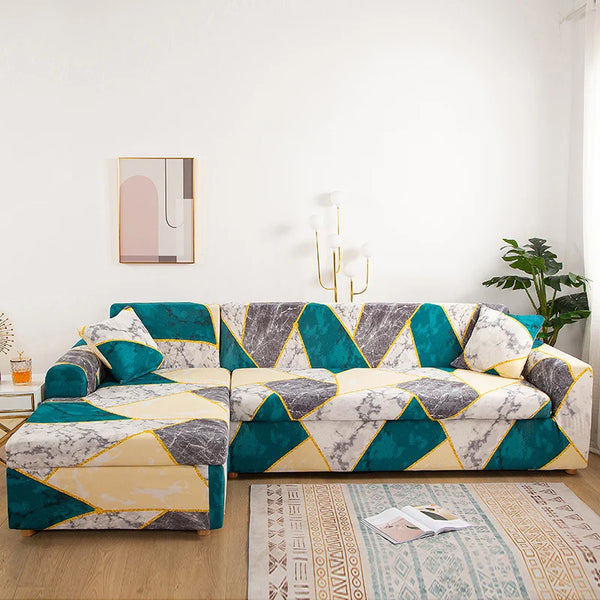A modern L-shaped sofa protector cover featuring a geometric pattern of teal, gray, and cream colors.