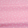 Pink floral and stripe cotton twill fabric rolled for sewing and DIY projects