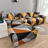 L-shaped sofa protector covers featuring a geometric pattern in black, gray, orange, and yellow tones.