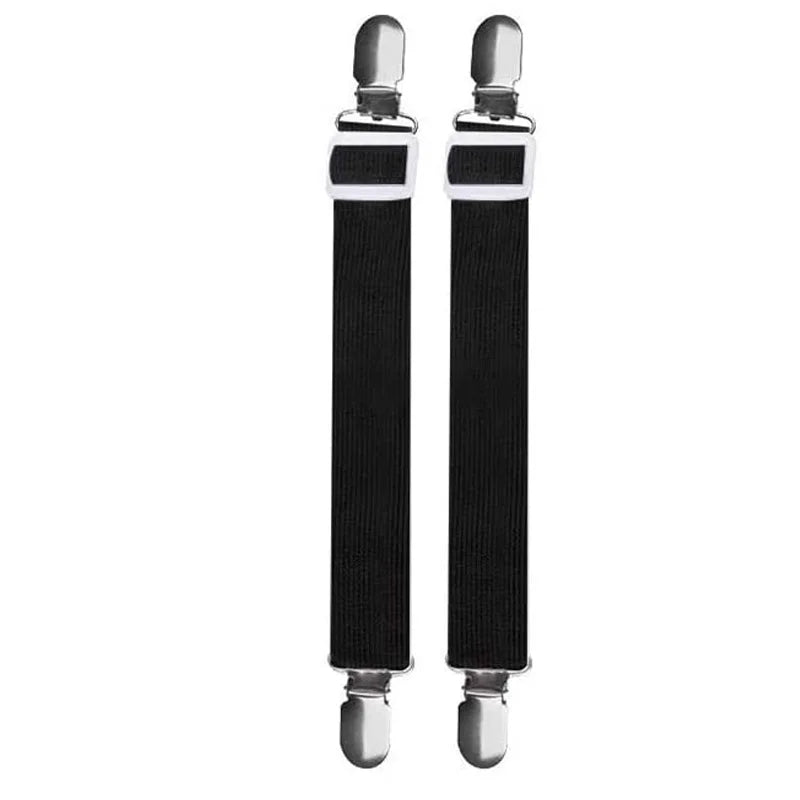 A pair of black adjustable bed sheet grippers with silver fasteners.
