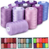 A collection of purple and blue polyester sewing thread spools in various shades and colors.