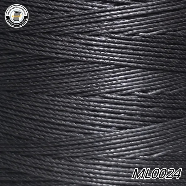 Close-up view of black waxed thread embroidery cord fibers.