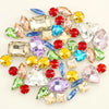 A collection of 50 assorted silver claw rhinestone decorations in various colors including pink, green, blue, yellow, and red