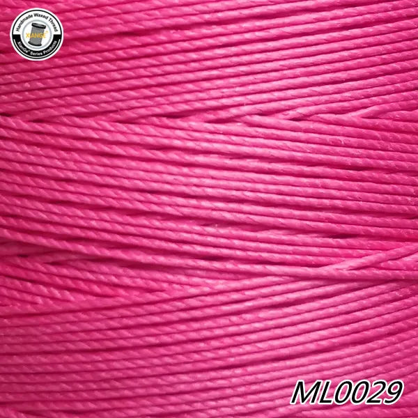 Pink wax thread embroidery cord in a spool, showing the fine strands of the material.