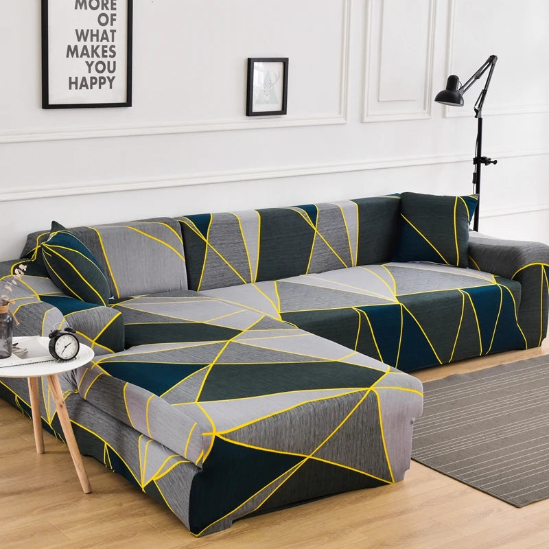L-shaped sofa protector covers in gray and navy blue geometric pattern on a light wood floor.