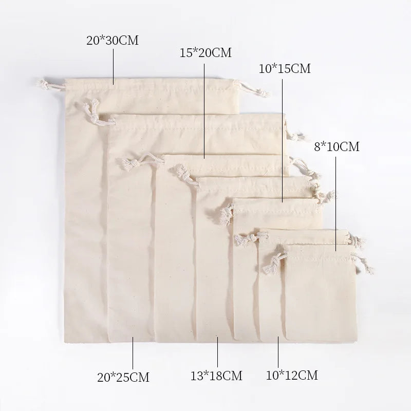 A set of ten natural beige cotton drawstring gift bags displayed in a vertical arrangement.