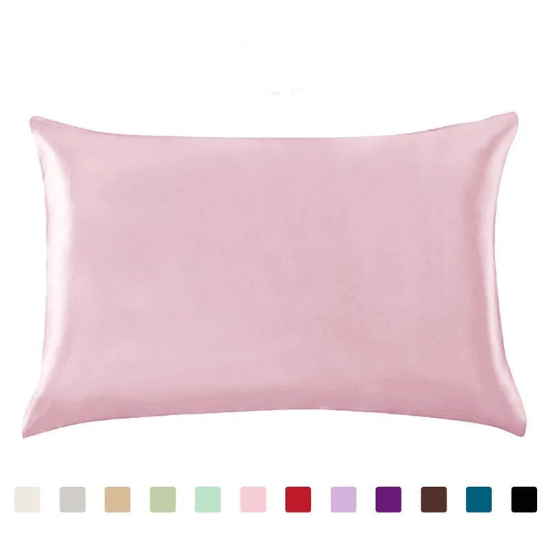 A square pink satin pillowcase shown flat, with a color palette of various pastel and deep shades.