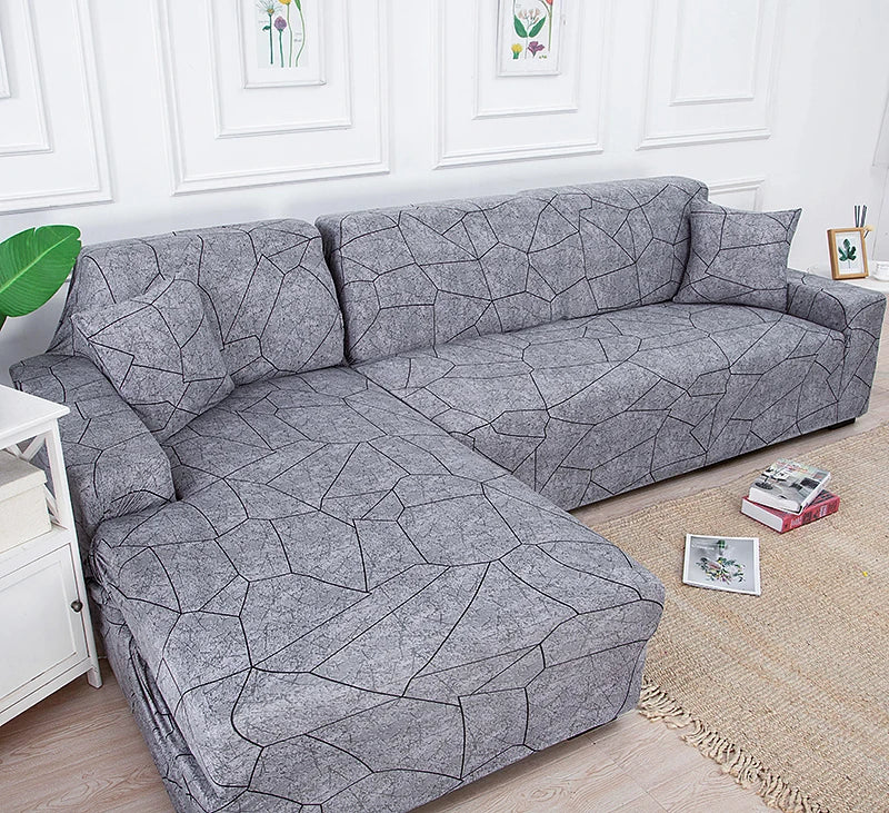 Gray L-shaped sofa protector covers displayed on a light wood floor.