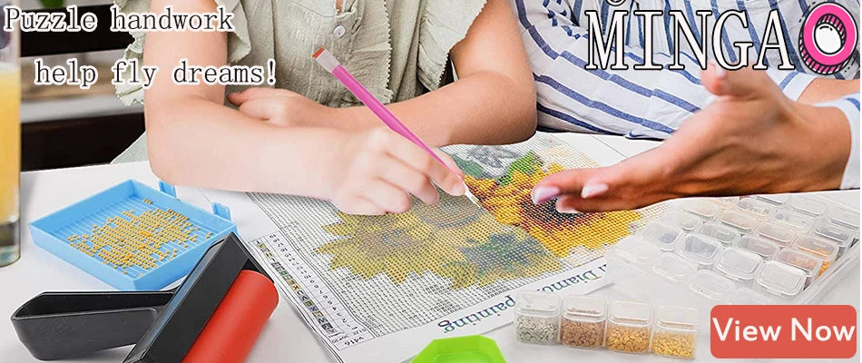 Hands are working on a puzzle or craft project with embroidery thread and fabric on a table.