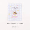 A white square tag featuring a pink and yellow checkered pattern with text in Japanese and an illustration of a decorated cup