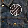 A close-up of a dark denim jacket featuring an embroidered Valknut Viking patch on the chest pocket.