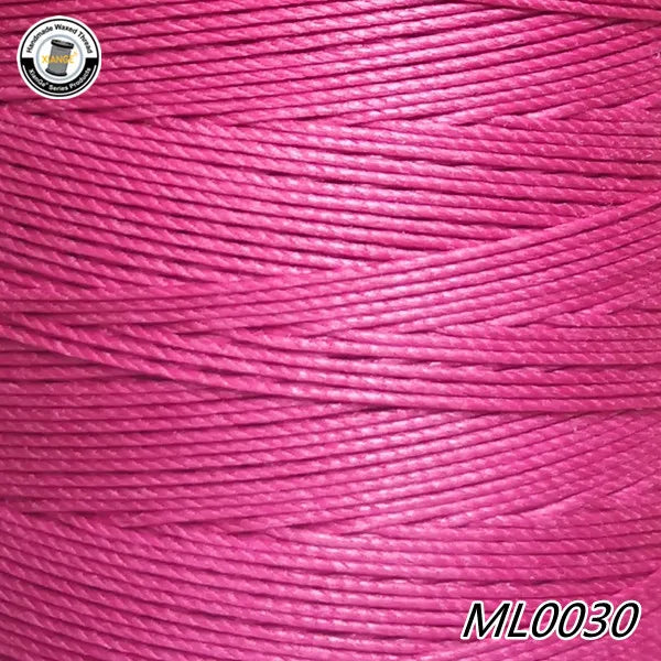 Pink waxed thread embroidery cord spool with a white label and the product code ML0030