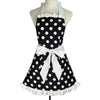 A black polka dot ruffle apron with white trim and a bow displayed on a mannequin.