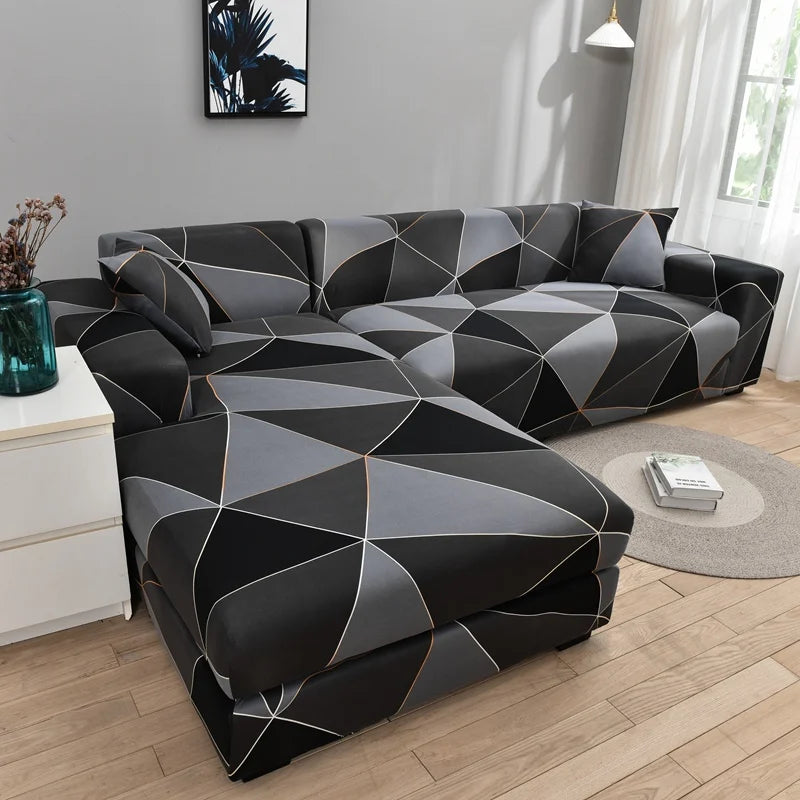 L-shaped sofa protector covers in black and gray geometric pattern on a modern sofa.