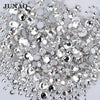 A pile of clear glass rhinestones and sequins for DIY crafts